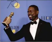  ??  ?? “THIS IS US” star Sterling K. Brown celebrates his lead actor TV drama victory backstage at the Globes.