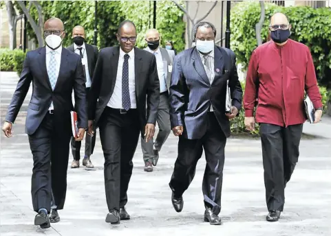  ?? Picture: Esa Alexander ?? Finance minister Tito Mboweni, second from right, arriving for his medium-term budget speech in parliament in Cape Town this week.