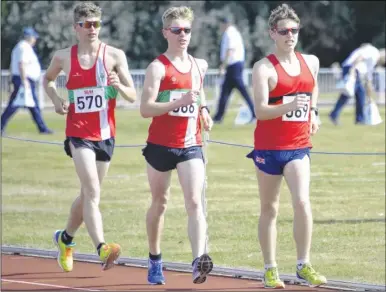  ?? Pictures: Paul Amos FM4463171 above, FM4463173 below ?? Medway & Maidstone’s Cameron Corbishley leads the way in the under-20 5km walk, above, and, below, Isaac Milham in the under-17 400m hurdles