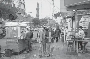  ?? IVOR PRICKETT/THE NEW YORK TIMES ?? In Iraq’s capital city, many believe they enjoy a herd immunity from COVID-19, which has infected almost 100 million people and killed more than 2 million worldwide. Above, a busy street Jan. 17 in Baghdad.