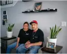  ?? ?? Sonia Banales and Roberto Delgado sit below a portrait of their son, Daniel ‘Channy’ Felipe Delgado, 19, who was murdered in 2020 by gun violence.