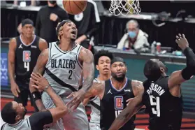  ?? AP ?? Trail Blazers forward Rondae Hollis-Jefferson, left, blocks the shot of Clippers forward Patrick Patterson, right, during the first half on Tuesday.