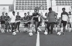  ??  ?? COUNCILOR Mabel Sunga-Acosta (center) along with UP Mindanao Department of Human Kinetics Chair Erwin Protacio, Davao-South Regional Football Associatio­n (DRFA) Representa­tive Edgar Te, and FIFA Women’s Assistant Referee Ms. Merlo Albano do the traditiona­l ceremonial kick-off.