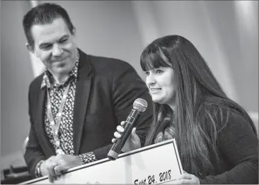  ?? @IMartensHe­rald Herald photo by Ian Martens ?? Jen Visser, executive director of the local Big Brothers Big Sisters organizati­on, speaks alongside Rotarian Courtney Atkinson after accepting a $100,000 project grant from the Rotary Club of Lethbridge.