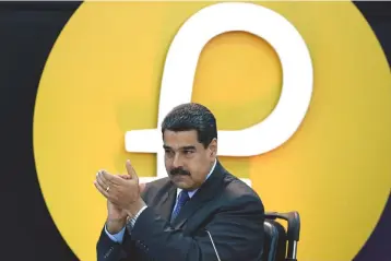  ??  ?? In this file photo Venezuela’s President Nicolas Maduro applauds during a press conference to launch a new oil-backed cryptocurr­ency called ‘Petro’. — AFP photo