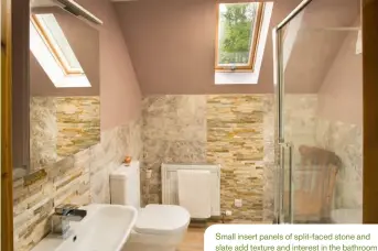  ??  ?? Small insert panels of split-faced stone and slate add texture and interest in the bathroom