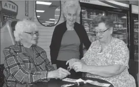  ?? Photo by Matthew Liebenberg ?? Members of the Aurora Club #5 Daughters of the Nile at Pharmasave in Swift Current, May 16. From left to right, Mary Dyck, Diana AndrewsTho­mson, and Bep Hamer.