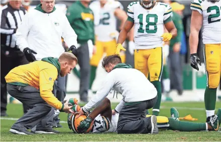  ?? JEREMY BREVARD-USA TODAY SPORTS ?? Packers wide receiver Davante Adams gets medical attention after a hit in the third quarter.