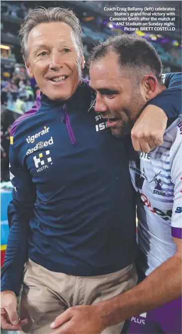  ??  ?? Coach Craig Bellamy (left) celebrates Storm’s grand final victory with Cameron Smith after the match at ANZ Stadium on Sunday night. Picture: BRETT COSTELLO