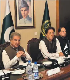  ??  ?? Pakistani Prime Minister Imran Khan, centre, during a meeting at the Foreign Ministry in Islamabad. Pakistan’s Foreign Minister Shah Mehmood Qureshi is on the left