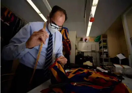  ?? AFP/VNA Photo ?? STITCH IN TIME: Tailor Ety Cicioni began making the uniforms in 1997 under pope John Paul II.