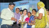  ??  ?? Dignitarie­s lighting lamp at the inaugural function in Lucknow.