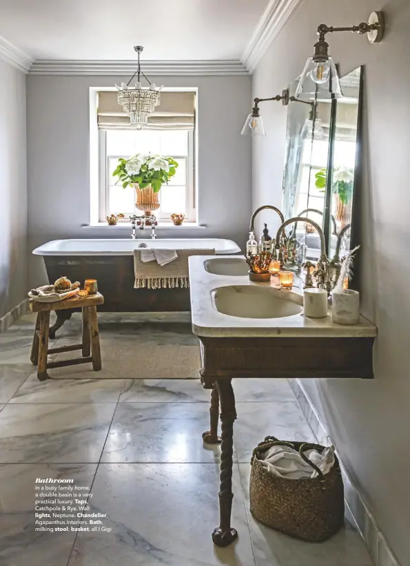  ??  ?? Bathroom
In a busy family home, a double basin is a very practical luxury. Taps,
Catchpole & Rye. Wall
lights, Neptune. Chandelier, Agapanthus Interiors. Bath; milking stool; basket, all I Gigi