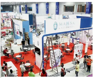  ??  ?? Ready for the big event: MAHSA University setting up its booths at the Star Education Fair 2018 at KL Convention Centre. It is the second biggest exhibitor with 10 booths.
