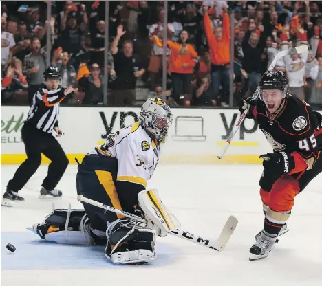  ?? VICTOR DECOLONGON/GETTY IMAGES ?? Sami Vatanen, right, of the Anaheim Ducks reacts after scoring the eventual game-winner on a breakaway against goaltender Pekka Rinne of the Nashville Predators, in the third period of Anaheim’s 5-2 win in Game 5 on Saturday, in Anaheim, Calif.