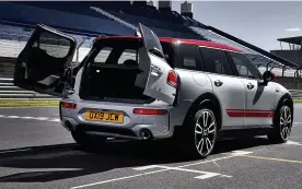  ??  ?? REAR OF THE YEAR: The clubman’s cool doors are a flashback to the classic Countryman and, right, the dashboard is all familiar Mini