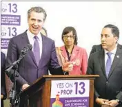  ?? Sandy Huffaker San Diego Union- Tribune ?? GOV. GAVIN NEWSOM, left, endorses Propositio­n 15, a “split- roll” tax measure that targets commercial and industrial properties. Polls show a close vote.