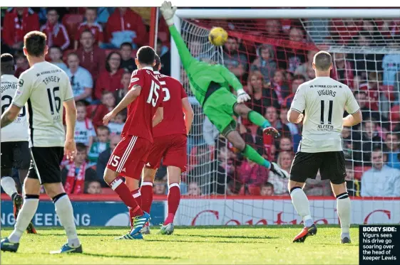  ??  ?? BOGEY SIDE: Vigurs sees his drive go soaring over the head of keeper Lewis