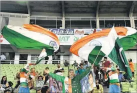  ?? AFP PHOTO ?? Both Indian and Pakistani flags were waved alongside each other at the neutral venue.