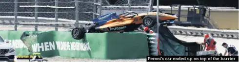  ??  ?? Peroni’s car ended up on top of the barrier