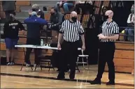  ?? Contribute­d photo ?? Steve Wodarski and his son Ryan officiate a basketball game together during the 2021 high school season.