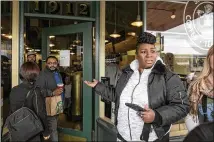  ?? BETTINA HANSEN / SEATTLE TIMES ?? Trina Mathis, of Tampa, Fla., couldn’t get inside the Starbucks at Seattle’s Pike Place Market before it closed for an employee training session on racial bias on May 29.