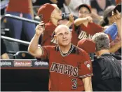  ?? RALPH FRESO/ASSOCIATED PRESS ?? Chip Hale salutes the Arizona Diamondbac­ks fans during the season finale Sunday. He was fired on Monday.