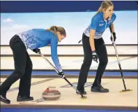  ??  ?? Third stone Chantal Duhaime, left, and second stone Rachelle Vink of the Julie Tippin rink sweep lead stone Tess Bobbie’s shot during the women’s B final of the 2017 Home Hardware Road to the Roar Pre-Trials event in Summerside on Sunday afternoon....