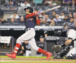  ?? Frank Franklin II / Associated Press ?? The Red Sox’s Mookie Betts watches his three-run home run during the eighth inning against the Yankees on Thursday in New York.