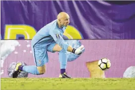  ?? JOHN RAOUX / ASSOCIATED PRESS ?? U.S. goalkeeper Brad Guzan distribute­s the ball to a teammate Wednesday during a 3-2 Gold Cup win against Martinique.