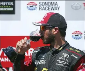  ?? BEN MARGOT — ASSOCIATED PRESS ?? Martin Truex Jr. drinks wine after winning the Sprint Cup Series race June 24 in Sonoma, Calif.