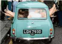  ??  ?? CAR-AZY Here is the popular Mini car filled with 14 miniskirte­d maidens, plus one in the boot, in the summer of 1966 in a successful world record attempt for the most people in a Mini
