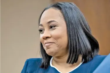  ?? AP PHOTO/BEN GRAY ?? Fulton County District Attorney Fani Willis watches in court in May in Atlanta during proceeding­s on actions after the 2020 election by former President Donald Trump and his supporters.