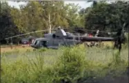  ?? THE ASSOCIATED PRESS ?? A Thai military evacuation helicopter waits as the remaining trapped boys and their coach are extracted from a cave in Mae Sai, Chiang Rai province, northern Thailand, on Tuesday.