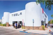  ?? EDDIE MOORE / JOURNAL ?? Tesla opened of a sales and service center in Nambé on Sept. 8, 2021. The world’s largest EV maker escaped the confines of New Mexico’s auto franchise act by opening a dealership on tribal land.