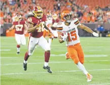  ?? RON SCHWANE/ASSOCIATED PRESS ?? Browns wide receiver Damon Sheehy-Guiseppi runs an 86-yard punt return for a touchdown Thursday against the Redskins in Cleveland. He bluffed his way into a Browns tryout, then made the most of his opportunit­y.