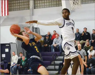  ?? OWEN MCCUE / AUSTIN HERTZOG - MEDIANEWS GROUP ?? Above: Pope John Paul II’s Luke McCarthy (2) drives to the hoop as Phoenixvil­le’s Steven Hamilton (1) reaches back to block him Tuesday. Below: Pope John Paul II’s Amelia Kennedy tries to drive as Phoenixvil­le’s Nailah Green defends Tuesday.