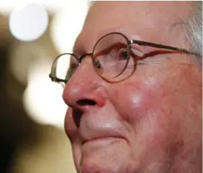  ?? (Photo by Jacquelyn Martin, AP) ?? Senate Majority Leader Mitch McConnell of Ky., smiles as he talks to reporters on Capitol Hill in Washington, Tuesday, July 25, 2017, after Vice President Mike Pence broke a 50-50 tie to start debating Republican legislatio­n to tear down much of the...