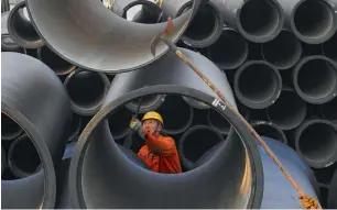  ?? AFP ?? Cast pipes in Lianyungan­g port, Jiangsu province, on Thursday. Big manufactur­ing powerhouse­s such as China are among the big winners in trade as 2017 draws to a close. —