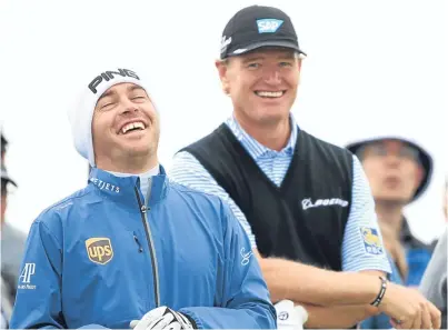  ?? Picture: Getty Images. ?? Louis Oosthuizen enjoys a joke with Ernie Els on the 13th tee yesterday.