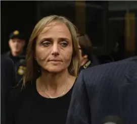  ?? CHRISTOPHE­R EVANS / HERALD STAFF FILE ?? CHECKS AND IMBALANCE: District Court Judge Shelley Richmond Joseph leaves Federal Court in Boston on April 25 after she was indicted on obstructio­n of justice charges.