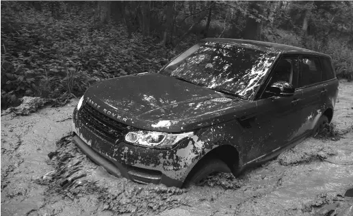  ??  ?? The redesigned Range Rover Sport makes gains in the handling department without losing any if its off-road prowess.