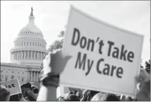  ?? ASSOCIATED PRESS ?? A LARGE GROUP OF PROTESTERS RALLY against the Senate Republican health care bill on the East Front of the Capitol Building in Washington on Wednesday.