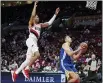  ?? ?? Warriors forward Nemanja Bjelica, right, shoots in front of Blazers guard Anfernee Simons last October.