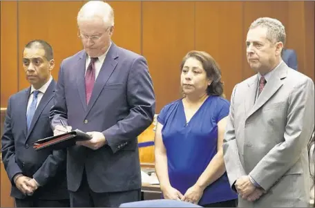 ?? Al Seib Los Angeles Times ?? LOS ANGELES school board member Ref Rodriguez, left, and his cousin Elizabeth Melendrez, second from right, in court with their attorneys, Daniel Nixon and Mark Werksman, respective­ly. The pair agreed to pay a joint $100,000 fine to the city’s Ethics...