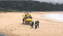  ?? Picture: SALLY RAFFERTY/TWITTER ?? The Westpac Rescue Chopper lands on Black Head Beach after the shark attack.