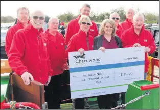  ??  ?? ■ Coun Deborah Taylor, the Council’s lead member for communitie­s with trustees and volunteers from The Baldwin Trust.