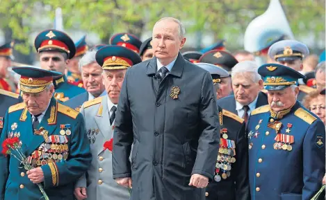  ?? ?? Russian President Vladimir Putin, centre, attends a wreath-laying ceremony at the Victory Day event in Moscow.