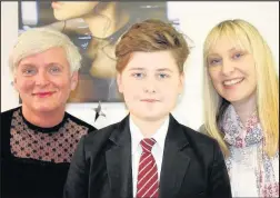  ??  ?? Hinckley’s KH Hair is backing the efforts of young cancer sufferer Ryan Swain in raising money for two charities which help fellow youngsters battling the disease. Pictured: Helen Fuller of KH Hair, Ryan Swain and his mum Faye