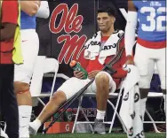  ?? Chris Graythen / Getty Images ?? Mississipp­i’s Matt Corral looks on from the sideline after he was injured during the first quarter against Baylor in the Sugar Bowl on Saturday. The injury to Corral, a potential first-round NFL draft pick, makes it clear why some players opt out of bowl games.